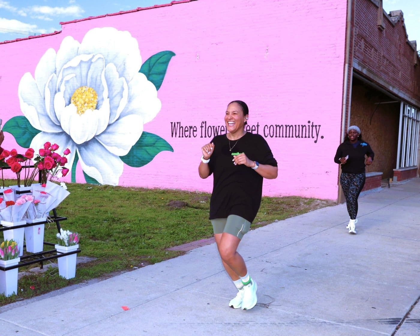 Runner passing a South Side mural